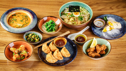 Set of assorted pan asian dishes. Chinese, Korean, Japanese cuisine. Soups, dumplings, noodles, rice and desserts.