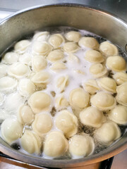 Delicious dumplings cooked in hot boiling water