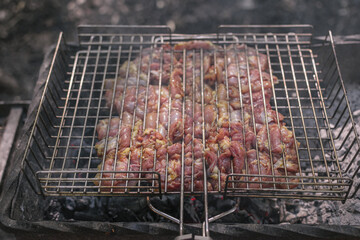Delicious meat cooked in a grill over burning coals
