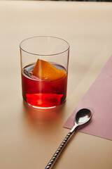 Cold alcoholic or non-alcoholic cocktail on pastel background. Hard light, deep shadow.