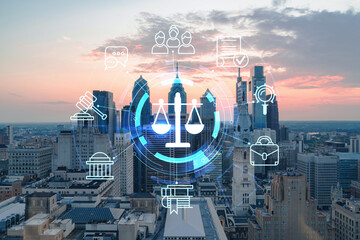 Aerial panoramic cityscape of Philadelphia financial downtown, Pennsylvania, USA. City Hall Clock Tower, sunset. Hologram of legal icons. The concept of law, order, regulations and digital justice.
