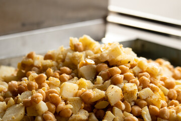 Fine Cut Peeled Boiled Baby Potato Also Called Alu Chola or Aloo With Kabuli Chana Soaked White Chickpeas Chhole Salad Mixed For Salted Indian Street Food Chaat Snacks