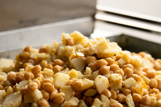 Fine Cut Peeled Boiled Baby Potato Also Called Alu Chola or Aloo With Kabuli Chana Soaked White Chickpeas Chhole Salad Mixed For Salted Indian Street Food Chaat Snacks