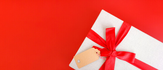 Red banner with gift box tied red ribbons