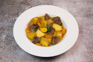 Recipe for beer and mustard beef chuck stew with potatoes, turnips and carrots, High quality photo