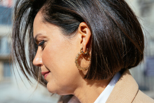 Mature woman with stylish earring