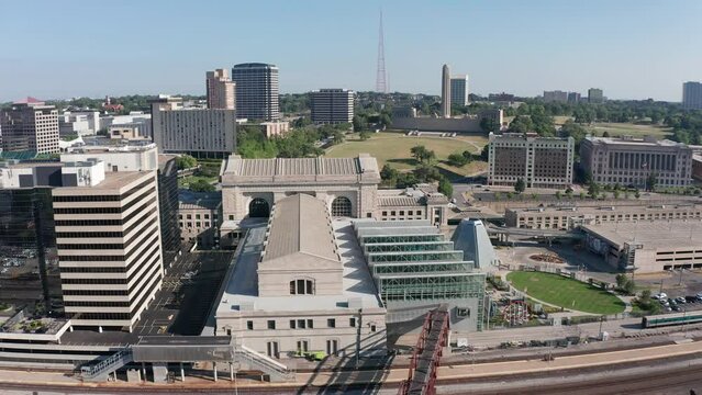 Wide panning aerial shot behind Union Station with the Liberty Tower World War 1 Memorial in the background in Kansas City, Missouri. 4K