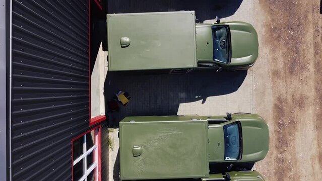 Bird eye view drone shot of several 4x4 trucks turned into ambulance vehicles for Ukraine.