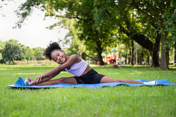 Training yoga African American kid girl at garden	