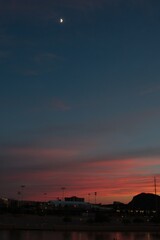 Golden hour during sunset with Moon in Tempe Arizona