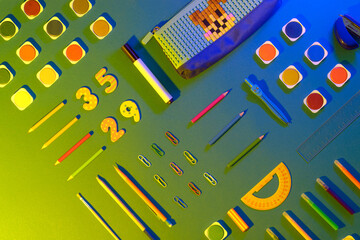 Flat lay with different school supplies on colored background. Copy space. Top view.