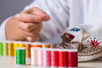 colored thread, embroidered garment, dressmaker, atelier, sewing, sewing clothes, embroidering a...