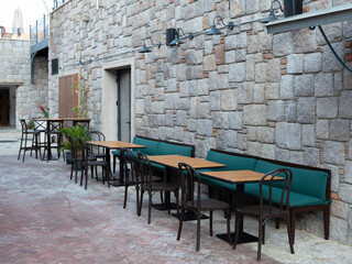wooden table in front of coffee shop, front view. Aspat Marina