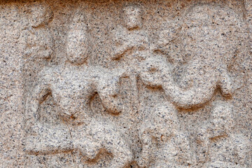 Bas relief rock cut sculptures of gods, people and animals are carved prominently in the monolithic cave temples at Mahabalipuram, Tamil nadu, India