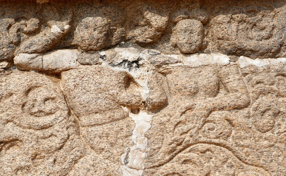 Bas relief rock cut sculptures of gods, people and animals are carved prominently in the monolithic cave temples at Mahabalipuram, Tamil nadu, India