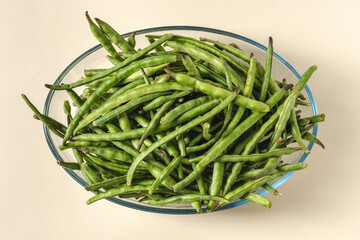 Fresh green beans in a glass bowl. Healthy eating concept