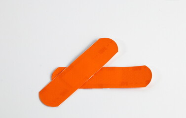 Plastic adhesive band aids, patch medical band, various colors and material. Isolated on white background.