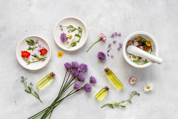 Medicinal herbs with mortar and essential oil bottle. Herbal apothecary