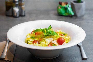 Vegetarian appetizing fresh salad served in a white plate