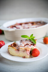 Sweet cottage cheese casserole with strawberry filling