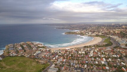 Aerial shot of Bondi Beach neighborhood under a gra cloudy sky © Wirestock Creators