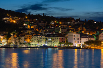 Evening city of Split in Croatia, reflection of the lights of the night city.