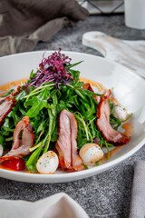 Smoked duck breast salad with vegetables and spices