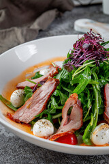 Smoked duck breast salad with vegetables and spices