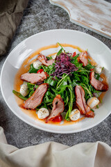 Smoked duck breast salad with vegetables and spices