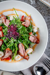 Smoked duck breast salad with vegetables and spices