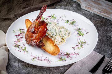 Smoked roasted rabbit leg. Served with mousse Three cheese, crusty bread with herbs, roasted zucchini