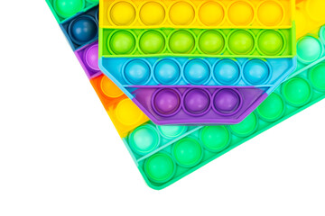 Pop it antistress close-up. Modern antistress toy. Background from rainbow toys. - obrazy, fototapety, plakaty