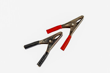 black and red electrical clamps isolated on white background