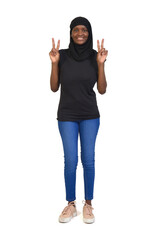 front view of a woman in burqa making victory sign with two hands