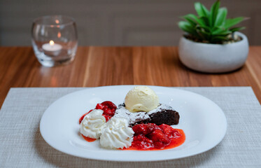  Brownie With Dark Chocolate, Whipped Cream, Ice Cream and Strawberry Puree