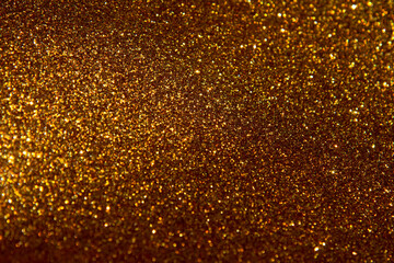 Golden color bokeh. Abstract gold glitter sparkle confetti gala background or golden texture party...