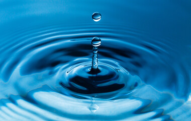 Naklejka na ściany i meble macro water drop,Blue splash water droplets round water droplets in glass drops, splashes, sprays, abstract shapes out of water