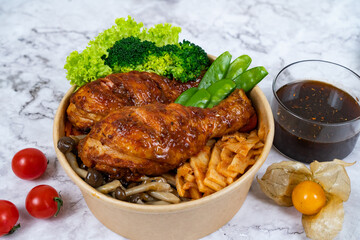 BAKED SAMBAL Chicken DRUMSTICK with noodle, mushroom tomato, carrot, cucumber and sauce served in a bowl isolated on grey background side view healthy korean food