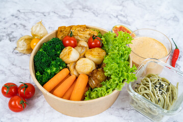STIR FRY TERIYAKI GARLIC SCALLOPS with salad, tomato and sauce served in a bowl isolated on grey background side view healthy korean food