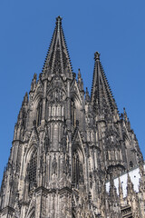 Fototapeta premium Details of Cologne cathedral (Cathedral Church of Saint Peter, from 1248). Cologne Cathedral - High Gothic five-aisled basilica, with a projecting transept and a tower facade. Cologne, Germany.