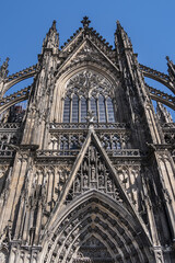 Fototapeta premium Details of Cologne cathedral (Cathedral Church of Saint Peter, from 1248). Cologne Cathedral - High Gothic five-aisled basilica, with a projecting transept and a tower facade. Cologne, Germany.
