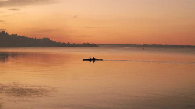 Couple in Kayak at sunset in puerto varas chile