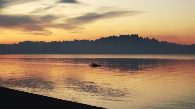 Couple in boat on the water in puerto varas chile