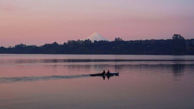 Couple in Kayak sailing on lake in puerto varas chile