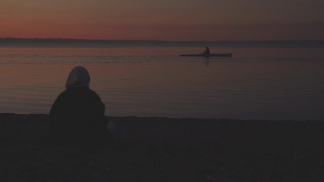 Girl looking at the kayak in puerto varas chile