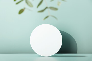 White Cylinder podium with eucalyptus leaves, geometric shadows. Scene to show products. Showcase, display case.