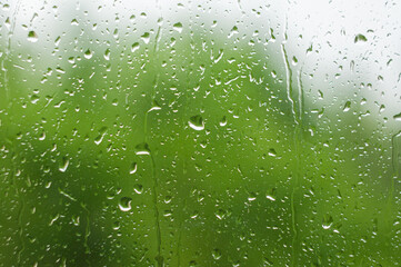 Rain drops on window glass in summer