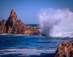 Fototapeta na wymiar .Magnificent wave breaking on the ocean stones.