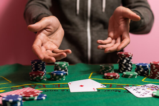 man playing blackjack at the table and betting chips