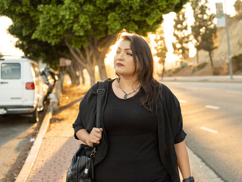 Native woman walking on the street